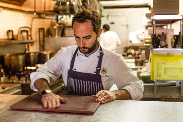 An Italian Chef working in the kitchen at Antica Pesa.